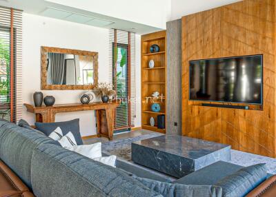 Modern living room with sofa, TV, and decorative elements