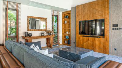 Modern living room with sofa, TV, and decorative elements