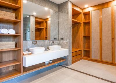 Modern bathroom with double sink and wooden storage