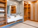 Modern bathroom with double sink and wooden storage