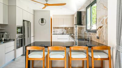 Modern kitchen with island and bar stools