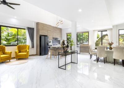 Spacious modern living room with dining area and large windows