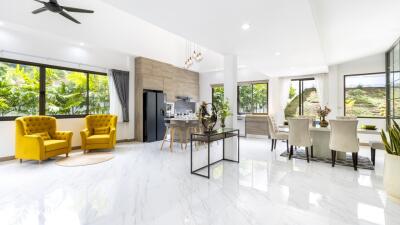 Spacious modern living room with dining area and large windows