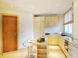 Modern kitchen with island and bar stools