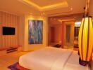 Modern bedroom with artwork and ambient lighting