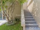 Outdoor area with stairs and greenery