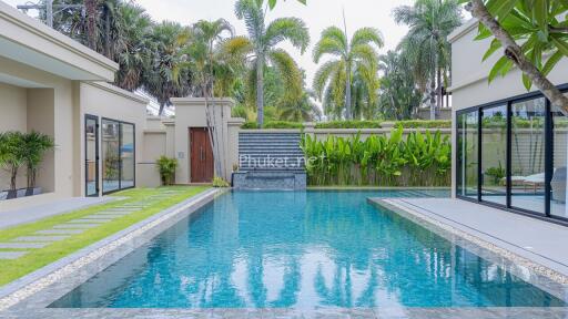 Luxurious outdoor pool area with surrounding greenery