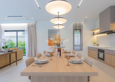 Modern dining area with adjacent open kitchen