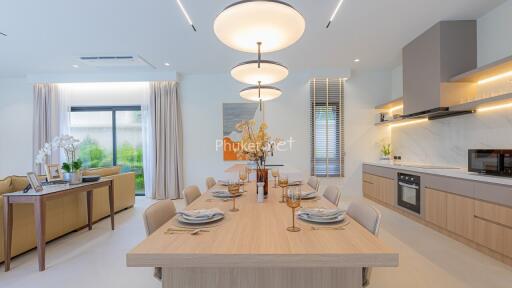 Modern dining area with adjacent open kitchen