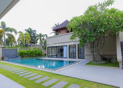 Modern outdoor area with swimming pool and greenery