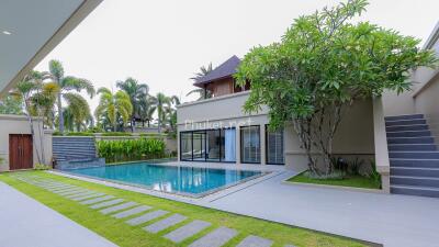 Modern outdoor area with swimming pool and greenery