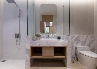 Modern bathroom with marble sink and spacious shower