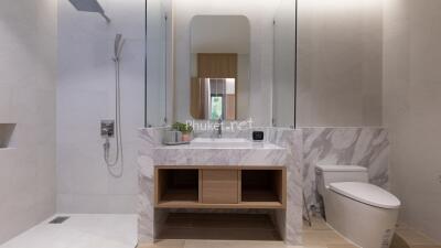 Modern bathroom with marble sink and spacious shower