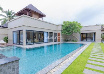 Exterior view of a luxury home with a swimming pool