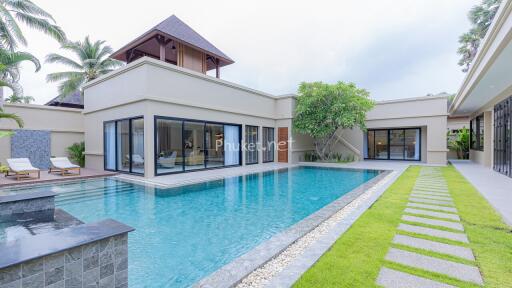 Exterior view of a luxury home with a swimming pool