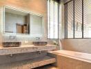 Modern bathroom with double sinks and bathtub