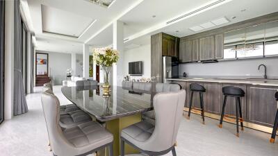 Modern kitchen and dining area with contemporary furnishings