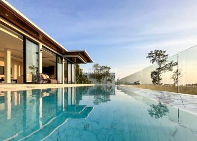 Exterior view of a modern house with a swimming pool