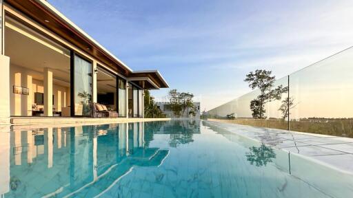 Exterior view of a modern house with a swimming pool