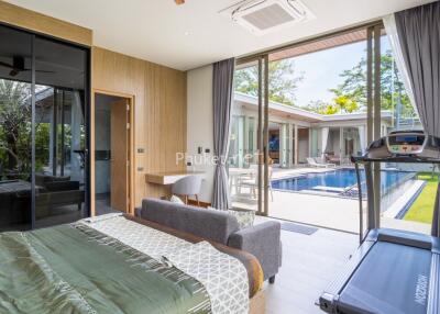 Modern bedroom with outdoor pool view