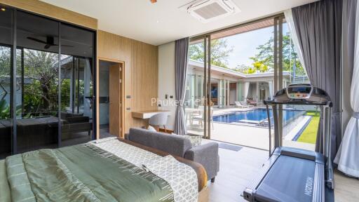 Modern bedroom with outdoor pool view