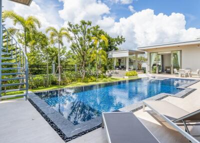 Modern outdoor area with pool and seating