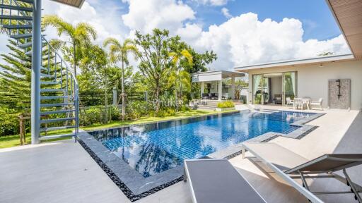 Modern outdoor area with pool and seating