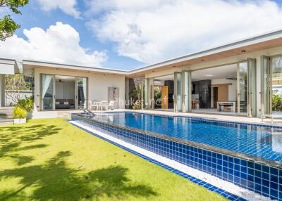 Modern house with swimming pool and outdoor seating area