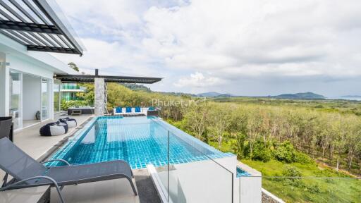 Modern building with an outdoor pool and scenic view