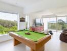 Spacious living area with pool table and panoramic view