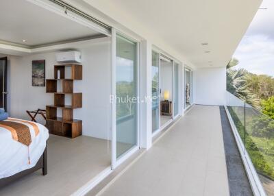 Modern bedroom and balcony with glass doors