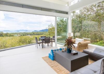 Modern living room with large windows and scenic view