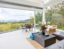 Modern living room with large windows and scenic view