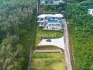 Aerial view of a modern house surrounded by greenery