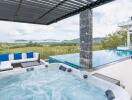 Luxurious outdoor area with jacuzzi, infinity pool, and scenic view
