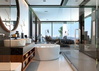 Modern bathroom with glass shower, large bathtub, and double sink