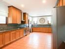 Spacious kitchen with wooden cabinets and modern appliances