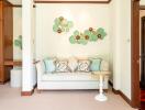 Cozy bedroom corner with sofa and decorative wall art