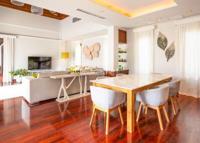 Modern living room with dining area and hardwood floors