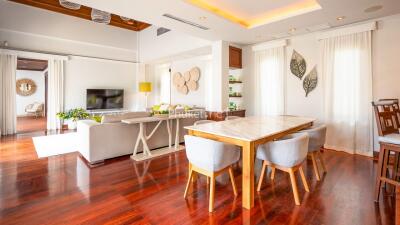 Modern living room with dining area and hardwood floors