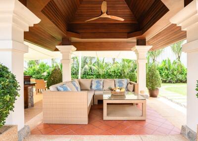 spacious outdoor patio with comfortable seating and ceiling fan