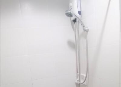 Bathroom with wall-mounted shower