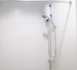 Bathroom with wall-mounted shower