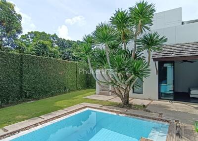 Outdoor area with pool and garden