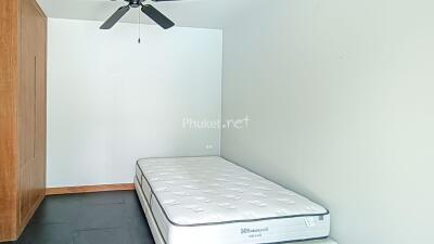 Bedroom with a mattress and ceiling fan