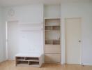 Minimalist living area with storage and shelves