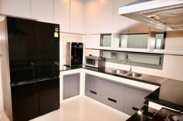 Modern kitchen with sleek appliances and cabinetry