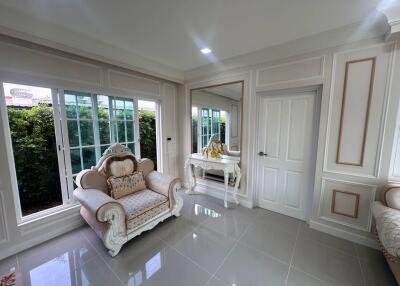 Well-lit living room with elegant furniture