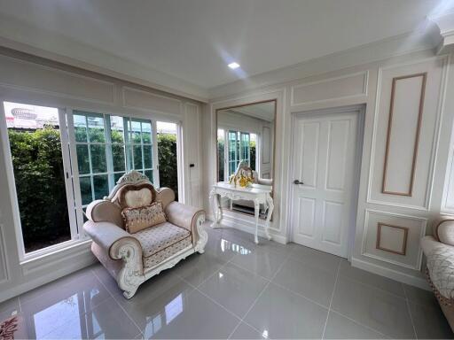 Well-lit living room with elegant furniture