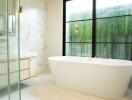 Modern bathroom with bathtub and large window